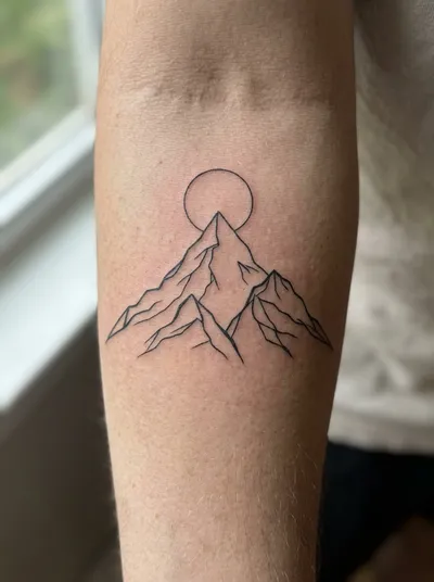 Fine line mountain tattoo on forearm — AI generated